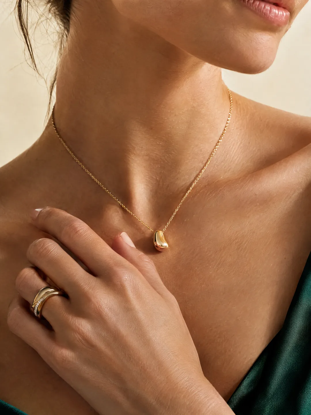 Sculptural gold necklace and stacked rings — SAIRAÉ Luxe jewelry edit